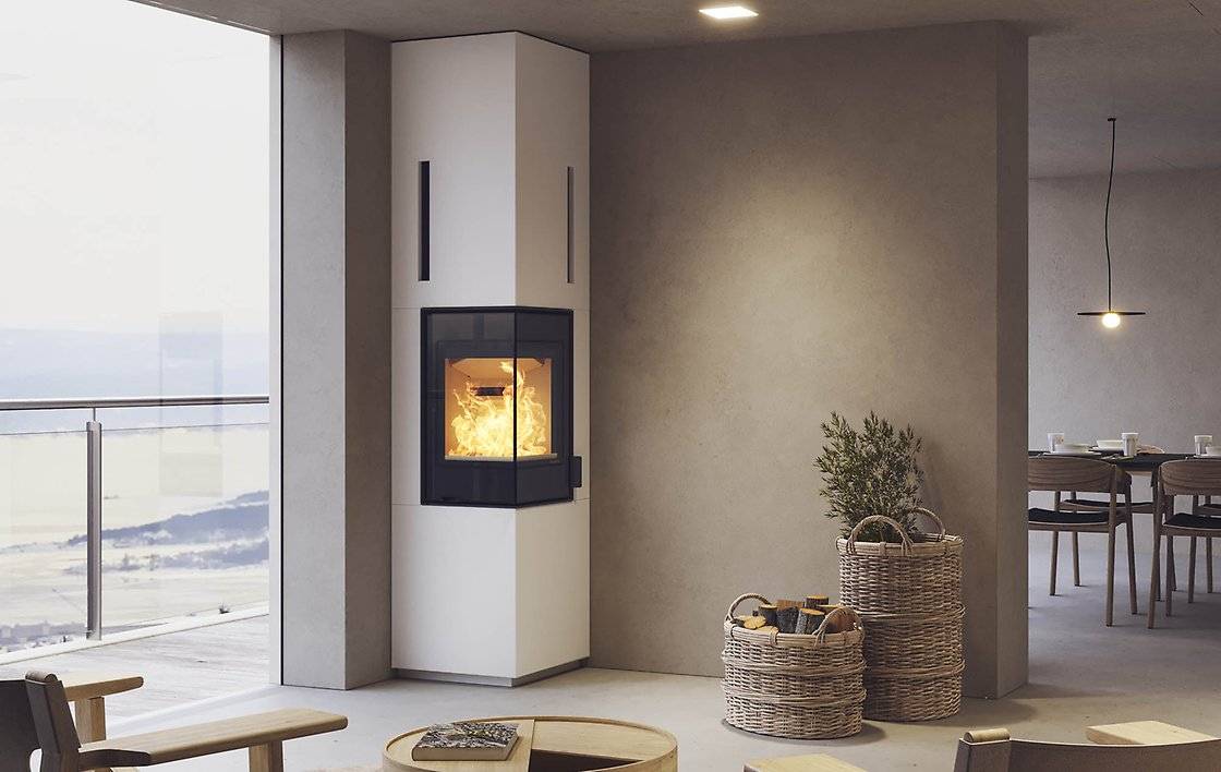 poele à bois d'angle avec accumulation de chaleur nordpeis